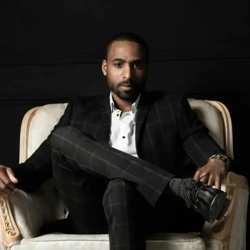 John Lasala is sitting on sofa